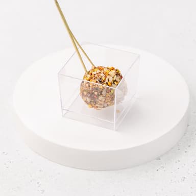 Сфера из финика, кураги, чернослива в рубленных миндальных лепестках